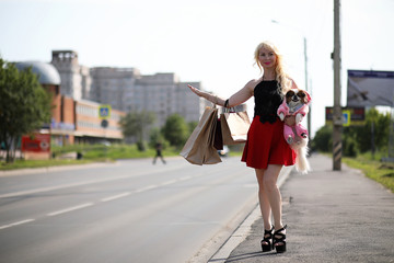 Beautiful young blonde with little dog