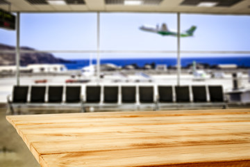 Desk of free space and airport background 