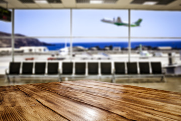 Desk of free space and airport background 