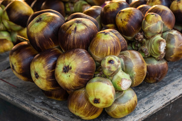 fresh Palmyra Palm fruit on dwooden table