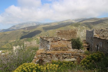Obraz premium Panoramic view of the ruined town Vathia and surrounding landscape, in spring. In the Inner Mani, Peloponnese, Greece, South-east Europe. It was built in the 18th and 19th century and is a great tou