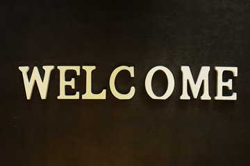 Obraz premium Background concept. Inscription Welcome on a dark background.