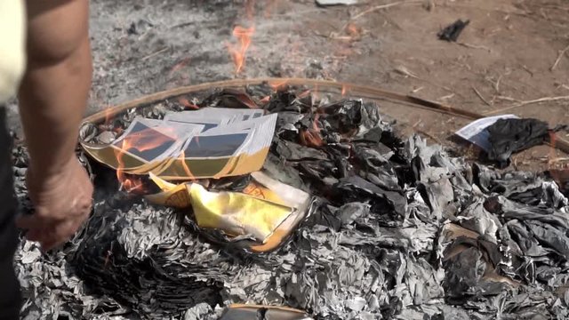 Burning Chinese joss paper for worship