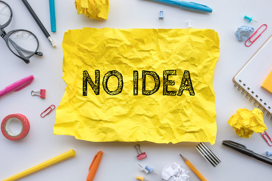 Inspiration creativity concepts with no idea taxt on yellow paper crumpled on worktable