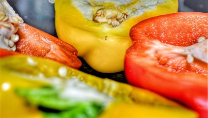 Yellow and Red Pepper on a black background