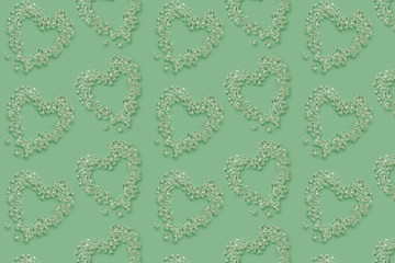 Beautiful green background with heart pattern of crystal beads for your text and design. space for...