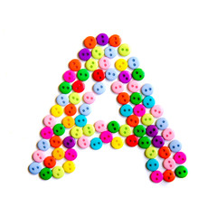 Letter A of the English alphabet made of multi-colored buttons