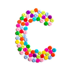 Letter C of the English alphabet made of multi-colored buttons