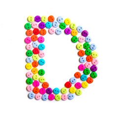 Letter D of the English alphabet made of multi-colored buttons