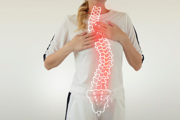 Pain in the spine, a woman with backache