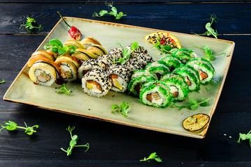 Sushi set on a black table