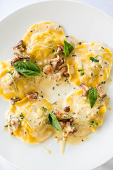 ravioli with mushrooms in a creamy sauce. Restaurant dish.