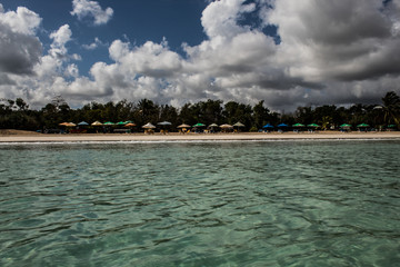 In the middle of an amazing, green and turquoise caribbean sea; transparent water, tropical paradise. Playa Macaro, Punta Cana, Dominican Republic.