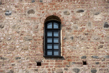Mir, Belarus, April 24, 2019: The wall with the window, the ancient castle, stone masonry, historic building