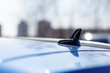 daylight. car. on the roof in the form of a fin antenna.