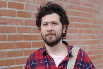 Fototapeta premium 30 years old guy on brick wall
