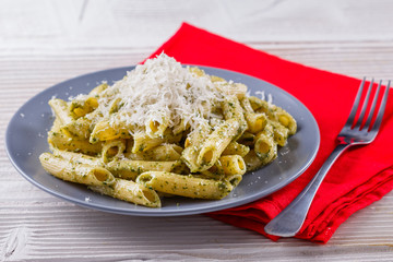 pasta pesto on a white wooden background