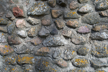 The texture of the stone is cemented by gray cement.