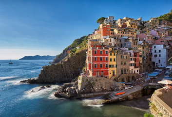 Fototapeta na wymiar Colorful long exposure picture of Riomaggiore on the Cinque Terre coast of Italy