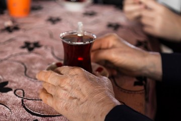 Fototapeta na wymiar old woman drinking tea