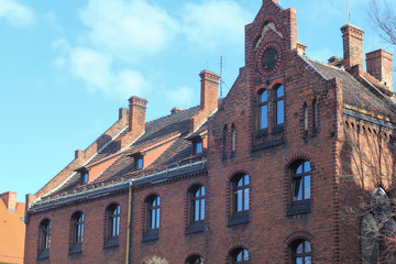 castle facade, castle roof, brick building, European architecture. Image