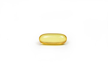 A Fish oil gold color isolated capsules on white background view. Salmon fish capsules view. Omega 3. Vitamin E. Supplementary food background.
