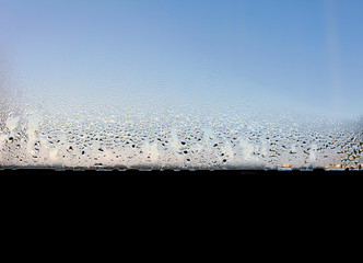 Water drops on the wet window glass. Abstract background.
