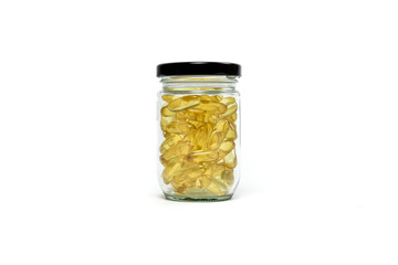 Gold fish oil isolated for good health on white background view. Supplementary food. Omega 3. Vitamin E. Capsules salmon fish oil.