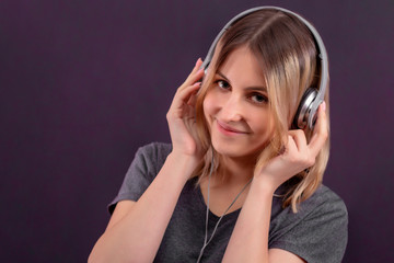 girl in headphones smiling and listening to music, generation z, young people, DJ