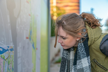 Woman is studying the route map