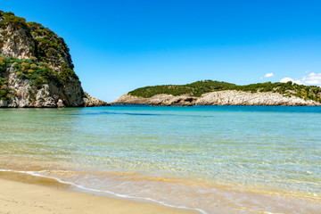 Fototapeta na wymiar Voidokilia Beach, popular white sand and blue clear water beach in Messinia in Mediterranean area in shape of Greek letter omega, Peloponnese, Greece.