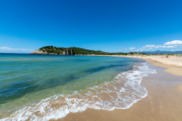 Voidokilia Beach, popular white sand and blue clear water beach in Messinia in Mediterranean area in shape of Greek letter omega, Peloponnese, Greece.
