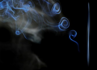 White smoke with cigarette isolated on black background
