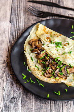 Pancakes with champignon, cheese and chive