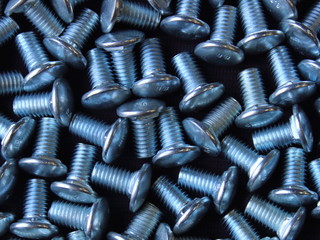 bolts with round hats blue texture background