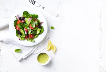 Zelfklevend Fotobehang Light summer salad with whole olives. Flat lay. Copy space. Vegan food © B.G. Photography
