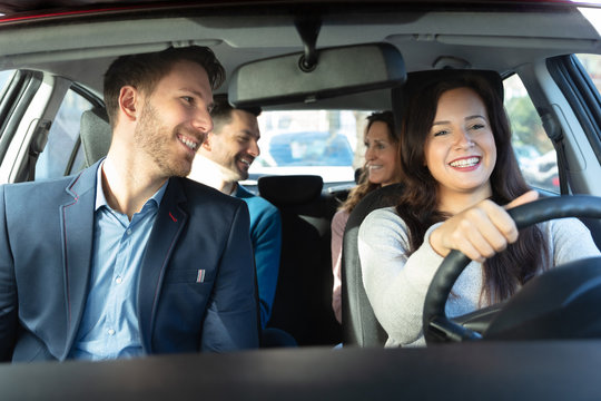 Smiling People Sitting In Car