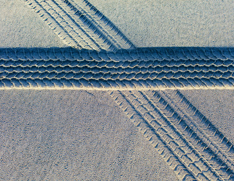 Tire tracks on the soft surface of sand on a beach. ,Long Beach Peninsula