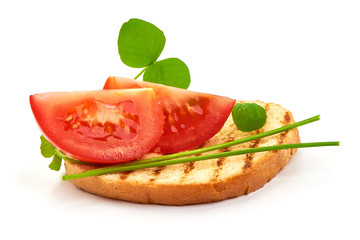 Toasted bread with tomatoes and herbs, close-up, isolated on white background