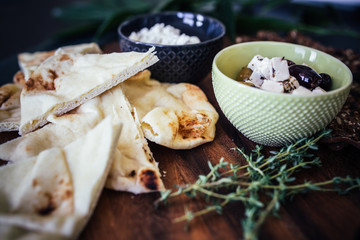 Closeup of Mediterranean Charcuterie board with Pita Bread and Cheese