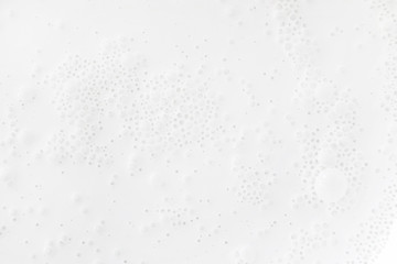 White surface with bubbles, top view