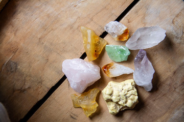 Collection of raw crystals, including quartz, rose quartz, citrine, amethyst, sulphur and amber.