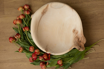 tub of wood decorated with tulips. basket for newborn photo shoot