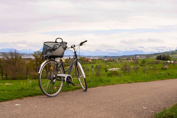 Fototapeta na wymiar Bike on the background of the Alps