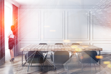 Woman in dining room with wooden table