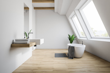 Fototapeta na wymiar Attic white bathroom interior, tub and sink