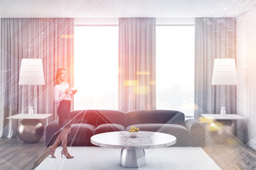 Blonde woman in living room interior