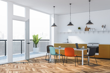 Bright colored kitchen corner with balcony