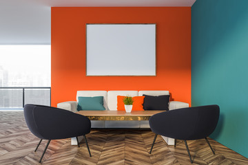 Orange and blue living room with balcony and poster