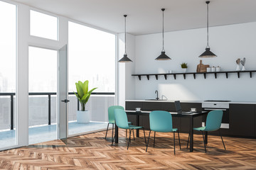 Gray countertop kitchen corner with balcony